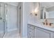 Modern bathroom with a glass enclosed shower, white marble floors, and brass hardware at 811 Maple Berry Ln # 104, Raleigh, NC 27607