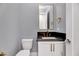 Stylish half-bathroom with a gray wall, floating vanity, and modern fixtures at 811 Maple Berry Ln # 104, Raleigh, NC 27607