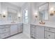 Bright bathroom with double vanity, marble countertops, framed mirrors, and modern fixtures at 811 Maple Berry Ln # 104, Raleigh, NC 27607