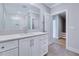 Contemporary bathroom with a large mirror, pristine countertops, and access to the staircase at 811 Maple Berry Ln # 104, Raleigh, NC 27607