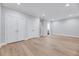 Bedroom featuring hardwood floors and double closets with simple decor at 811 Maple Berry Ln # 104, Raleigh, NC 27607