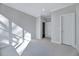 Spacious bedroom with neutral carpet, white trim, and ample natural light at 811 Maple Berry Ln # 104, Raleigh, NC 27607