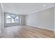 Large bedroom with hardwood floors and natural light from the window at 811 Maple Berry Ln # 104, Raleigh, NC 27607