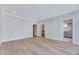 Open bedroom showcasing beautiful hardwood floors, recessed lighting, and an ensuite bathroom at 811 Maple Berry Ln # 104, Raleigh, NC 27607
