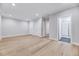 Spacious bedroom with hardwood floors, neutral walls, and an en-suite bathroom at 811 Maple Berry Ln # 104, Raleigh, NC 27607