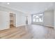 Expansive bedroom with hardwood flooring, a window, and convenient access to the walk-in closet at 811 Maple Berry Ln # 104, Raleigh, NC 27607