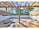 Outdoor deck with wooden pergola and privacy fence overlooking the yard at 811 Maple Berry Ln # 104, Raleigh, NC 27607
