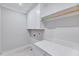 Functional laundry area with white cabinetry, a counter for folding, and ample storage at 811 Maple Berry Ln # 104, Raleigh, NC 27607