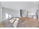 Expansive open living area shows staircase, kitchen, and multiple living spaces at 811 Maple Berry Ln # 104, Raleigh, NC 27607