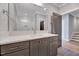 Bathroom featuring gray vanity with a white countertop and large mirror at 811 Maple Berry Ln # 105, Raleigh, NC 27607