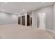 Carpeted bedroom offers recessed lighting, crown molding, and access to the bathroom at 811 Maple Berry Ln # 105, Raleigh, NC 27607