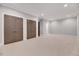 Spacious carpeted bedroom featuring recessed lighting, crown molding, and closet doors at 811 Maple Berry Ln # 105, Raleigh, NC 27607