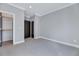 Bedroom features neutral carpet, fresh paint, closet and access to the bathroom at 811 Maple Berry Ln # 105, Raleigh, NC 27607