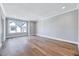 Spacious bedroom with hardwood floors, a window seat and a modern chandelier at 811 Maple Berry Ln # 105, Raleigh, NC 27607