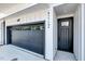 The home's exterior has an attached garage and a dark front door with the house number beside it at 811 Maple Berry Ln # 105, Raleigh, NC 27607