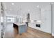 Bright kitchen featuring a large island, stainless steel appliances, and recessed lighting, creating an inviting culinary space at 811 Maple Berry Ln # 105, Raleigh, NC 27607