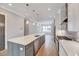 Kitchen showcasing a spacious island with a sink and stainless steel appliances for efficient meal preparation and entertaining at 811 Maple Berry Ln # 105, Raleigh, NC 27607