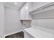 Functional laundry room features ample storage space and a utility sink at 811 Maple Berry Ln # 105, Raleigh, NC 27607