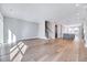 Expansive living area features hardwood flooring, recessed lighting, and an open layout connecting the kitchen and dining spaces at 811 Maple Berry Ln # 105, Raleigh, NC 27607