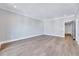 Spacious living room features hardwood flooring and natural light at 811 Maple Berry Ln # 105, Raleigh, NC 27607