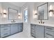 Modern bathroom features dual vanity with framed mirrors and contemporary lighting at 811 Maple Berry Ln # 106, Raleigh, NC 27607