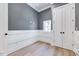 Comfortable bedroom with hardwood floors, white trim, and ample natural light at 811 Maple Berry Ln # 106, Raleigh, NC 27607