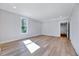 Bedroom with hardwood floors and neutral paint offers window views at 811 Maple Berry Ln # 106, Raleigh, NC 27607