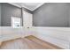 Cozy bedroom with hardwood floors, white trim, and natural light at 811 Maple Berry Ln # 106, Raleigh, NC 27607