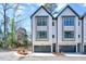 Charming townhome with a modern design, gray trim and a spacious two-car garage at 811 Maple Berry Ln # 106, Raleigh, NC 27607