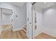 Hallway area with an elevator, access to stairs, and wood flooring at 811 Maple Berry Ln # 106, Raleigh, NC 27607