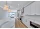 Modern kitchen with waterfall island, stainless appliances, and custom cabinetry at 811 Maple Berry Ln # 106, Raleigh, NC 27607