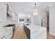 Beautiful kitchen featuring a large island, white cabinetry, and modern fixtures at 811 Maple Berry Ln # 106, Raleigh, NC 27607