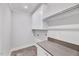 Laundry room with granite countertop, overhead cabinets and tile floor at 811 Maple Berry Ln # 106, Raleigh, NC 27607