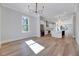 Bright dining area open to a modern kitchen and features hardwood floors at 811 Maple Berry Ln # 106, Raleigh, NC 27607