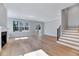 Bright living room features hardwood floors, fireplace, and access to the outdoors at 811 Maple Berry Ln # 106, Raleigh, NC 27607