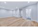 Main bedroom with an ensuite bathroom, hardwood floors, and walk-in closets at 811 Maple Berry Ln # 106, Raleigh, NC 27607