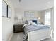 Bright bedroom features neutral walls, a large window, and a comfortable bed at 8841 Tartan Clan Dr, Willow Springs, NC 27592