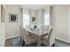 Cozy dining room features a stylish table set and two windows at 8841 Tartan Clan Dr, Willow Springs, NC 27592