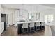 Modern kitchen with a large center island, pendant lighting, stainless appliances, and an open floor plan at 8841 Tartan Clan Dr, Willow Springs, NC 27592