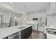 Well-lit kitchen with stainless appliances, a large island, and an open floor plan at 8841 Tartan Clan Dr, Willow Springs, NC 27592