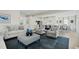 Open-concept living room boasts hardwood floors and seamlessly connects to the modern kitchen and dining area at 8841 Tartan Clan Dr, Willow Springs, NC 27592