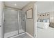 Modern shower with glass door and grey tile at 8841 Tartan Clan Dr, Willow Springs, NC 27592