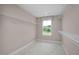 Spacious walk-in closet with ample shelving and a window offering natural light at 8841 Tartan Clan Dr, Willow Springs, NC 27592