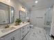Stylish bathroom with double vanity, neutral paint and a glass enclosed shower at 2710 - A Mansfield Ave, Durham, NC 27703