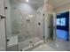 Modern bathroom showcasing a glass enclosed shower with marble tile and a built-in bench at 2710 - A Mansfield Ave, Durham, NC 27703
