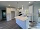Modern kitchen with white cabinets, stainless steel appliances, and a large island at 2710 - A Mansfield Ave, Durham, NC 27703