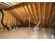 Unfinished attic space revealing roof rafters, duct work, and plywood sheathing and flooring at 55 Firefly Ln, Louisburg, NC 27549