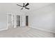 Bedroom with multiple doors leading to bathroom, closets, and stairs at 55 Firefly Ln, Louisburg, NC 27549