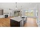 Gourmet kitchen with stainless steel appliances and a view into the living room at 55 Firefly Ln, Louisburg, NC 27549