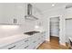 The gourmet kitchen features white cabinets, granite countertops, and stainless steel appliances at 55 Firefly Ln, Louisburg, NC 27549
